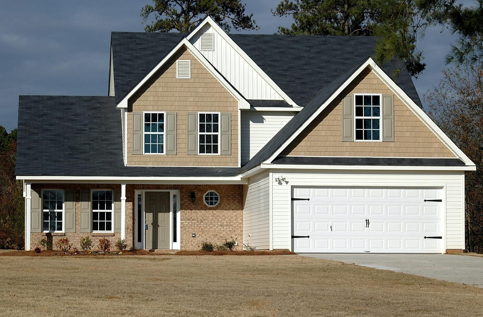 Elegant two-storey home with garage, showcasing modern architecture and residential charm.